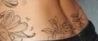 A picture of Floral tattoo on the lower back of Mila Kunis.